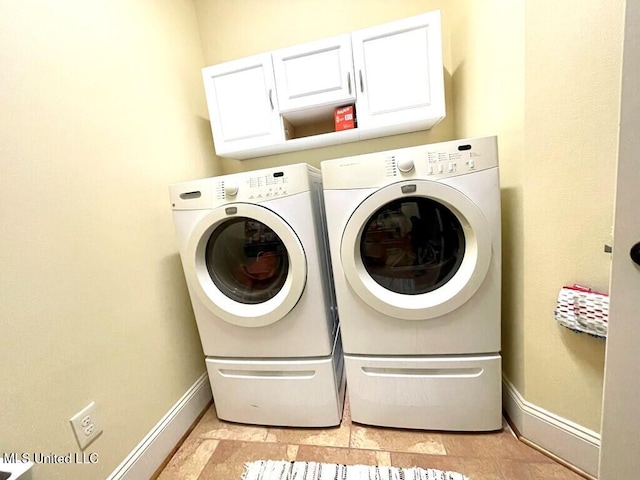 6 Lunker Ln, Poplarville, MS 39470 - washroom with washing machine and clothes dryer, baseboards, and cabinet space