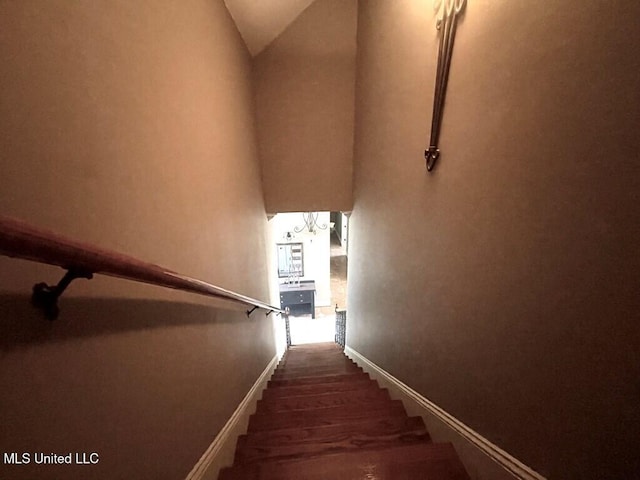 6 Lunker Ln, Poplarville, MS 39470 - stairs with lofted ceiling, wood finished floors, and baseboards