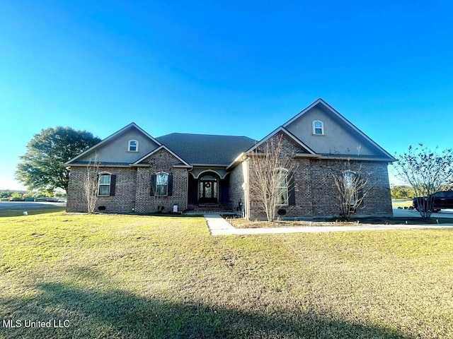 6 Lunker Ln, Poplarville, MS 39470 - ranch-style house featuring a front yard and brick siding