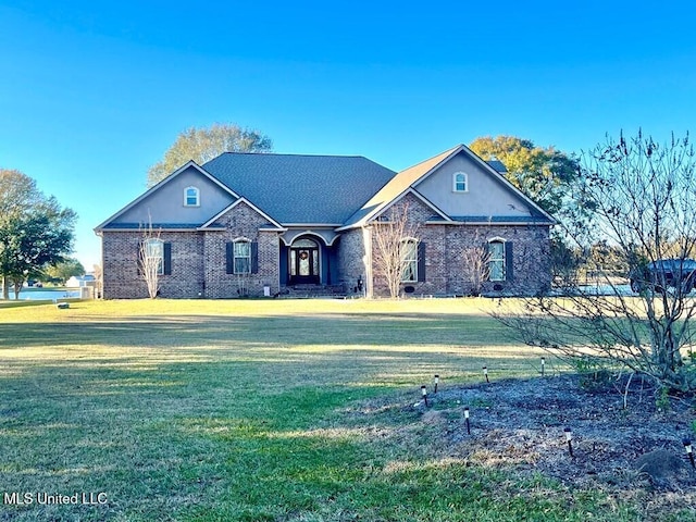 6 Lunker Ln, Poplarville, MS 39470 - view of front facade featuring a front yard and brick siding