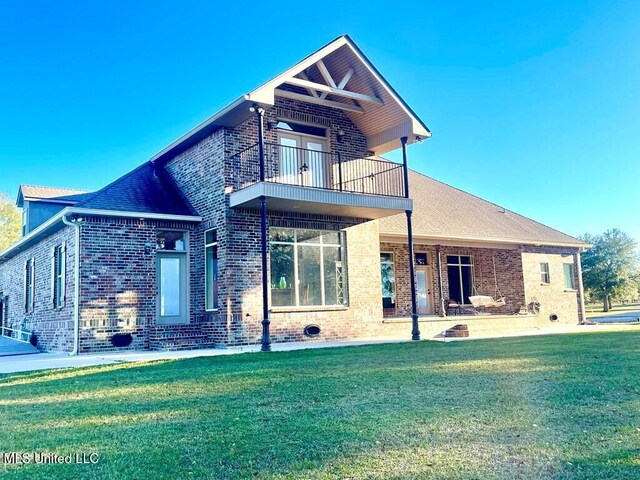 6 Lunker Ln, Poplarville, MS 39470 - rear view of property with a balcony, brick siding, and a lawn