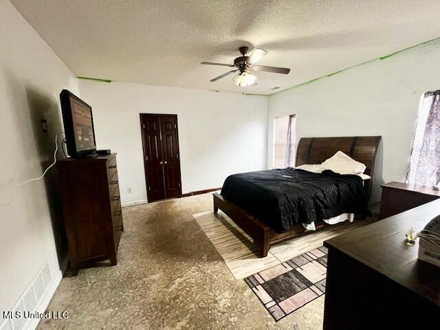 9064 Kyle Duran Ln, Olive Branch, MS 38654 - bedroom with a textured ceiling and a ceiling fan