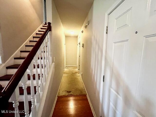 9064 Kyle Duran Ln, Olive Branch, MS 38654 - stairs featuring wood finished floors and baseboards