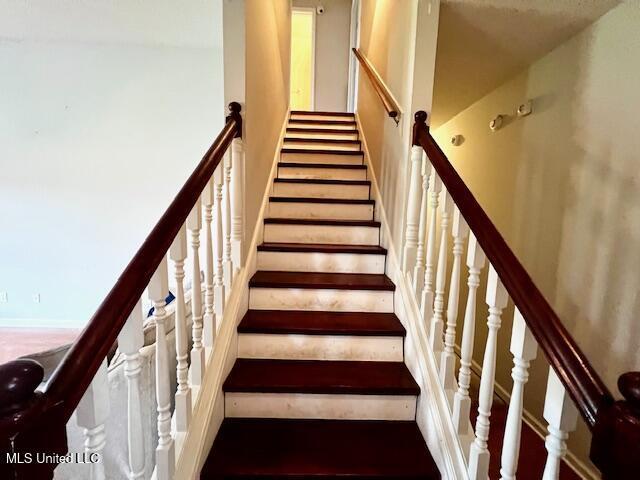 9064 Kyle Duran Ln, Olive Branch, MS 38654 - staircase with a towering ceiling