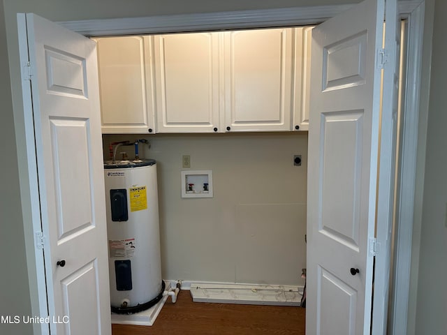 clothes washing area featuring cabinets, electric water heater, washer hookup, dark hardwood / wood-style floors, and electric dryer hookup