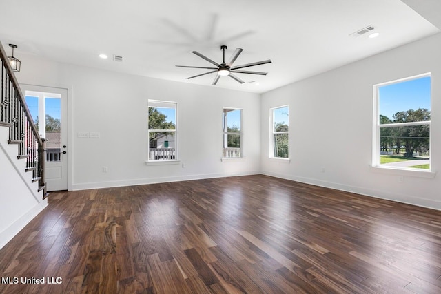 225 Magnolia Ave, Pass Christian, MS 39571 - unfurnished living room featuring stairs, dark wood-type flooring, ceiling fan, and recessed lighting