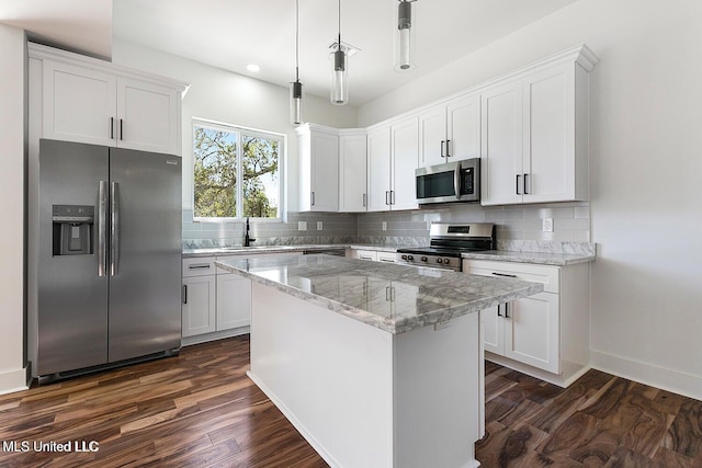 225 Magnolia Ave, Pass Christian, MS 39571 - kitchen featuring appliances with stainless steel finishes, dark wood-type flooring, decorative backsplash, and recessed lighting