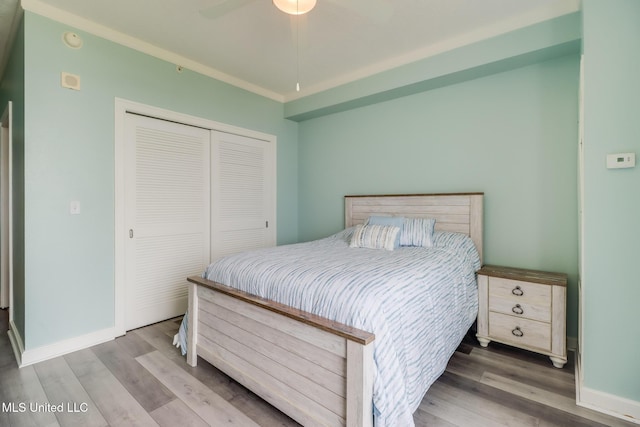 2060 Beach Blvd Unit 307, Biloxi, MS 39531 - bedroom featuring a closet, wood finished floors, baseboards, and a ceiling fan