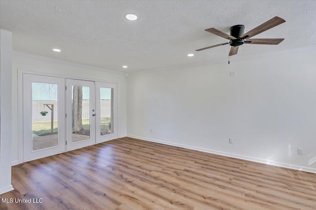 empty room featuring ornamental molding, recessed lighting, a textured ceiling, and wood finished floors