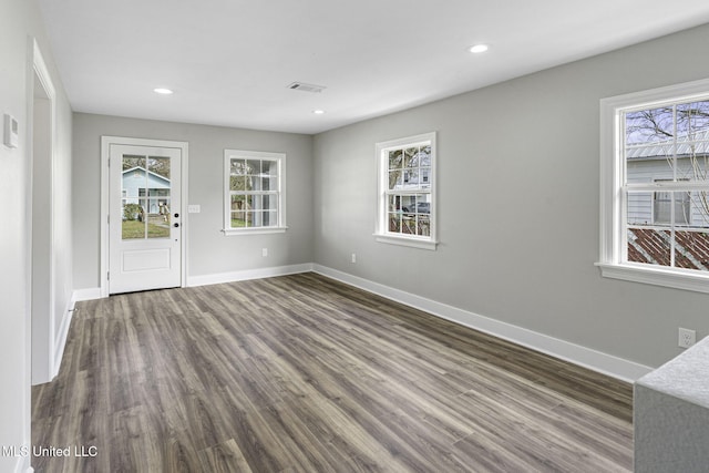 406 Easterbrook St, Bay Saint Louis, MS 39520 - interior space with baseboards, dark wood-style flooring, a wealth of natural light, and recessed lighting