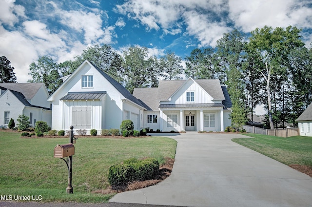 251 Westlake Cir, Madison, MS 39110 - modern inspired farmhouse featuring board and batten siding, driveway, a standing seam roof, a garage, and metal roof