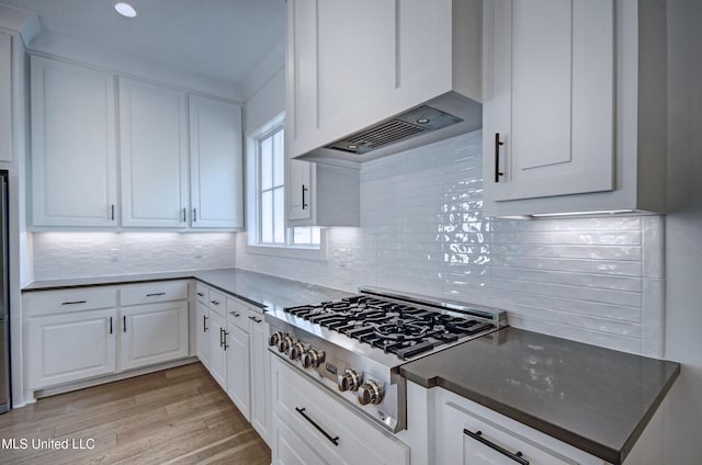 251 Westlake Cir, Madison, MS 39110 - kitchen with stainless steel gas stovetop, premium range hood, white cabinetry, light wood-style floors, and recessed lighting