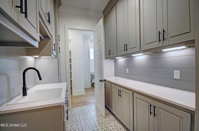 251 Westlake Cir, Madison, MS 39110 - laundry room with a sink, light flooring, and baseboards