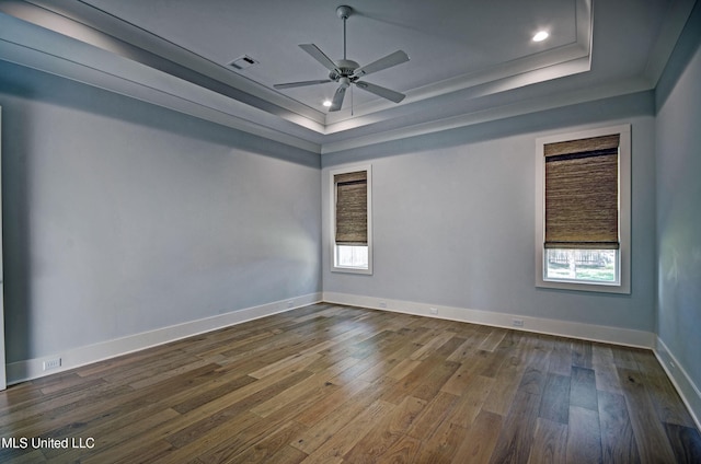 251 Westlake Cir, Madison, MS 39110 - unfurnished room featuring a raised ceiling, healthy amount of natural light, dark wood-style floors, crown molding, and recessed lighting
