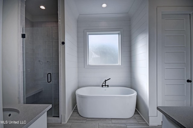 251 Westlake Cir, Madison, MS 39110 - bathroom featuring vanity, a freestanding tub, a shower stall, and recessed lighting
