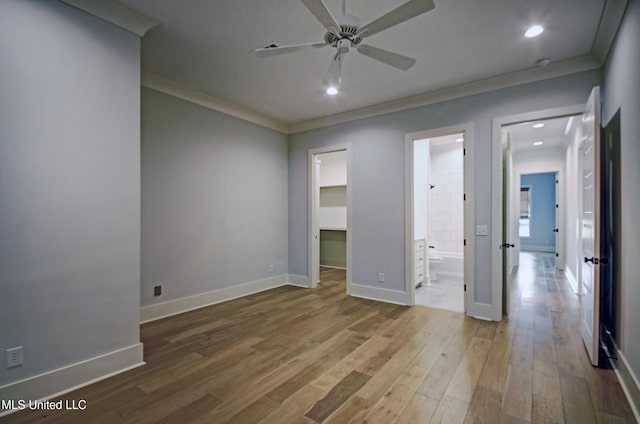251 Westlake Cir, Madison, MS 39110 - unfurnished bedroom featuring ornamental molding, wood finished floors, a spacious closet, baseboards, and recessed lighting