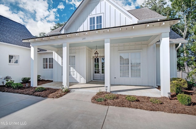 251 Westlake Cir, Madison, MS 39110 - modern inspired farmhouse featuring board and batten siding, roof with shingles, and covered porch