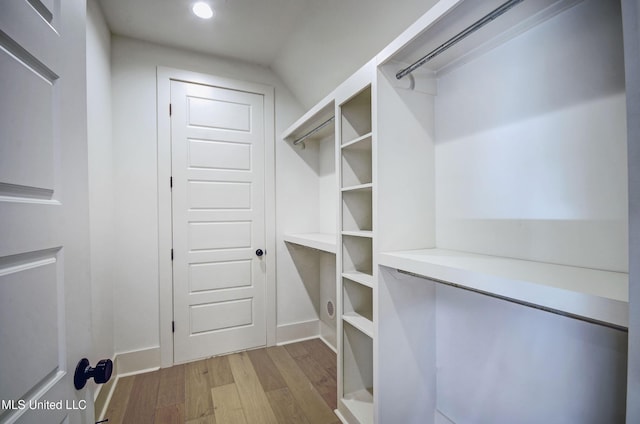 251 Westlake Cir, Madison, MS 39110 - walk in closet featuring wood finished floors