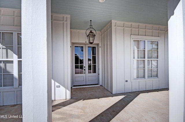 251 Westlake Cir, Madison, MS 39110 - view of exterior entry with board and batten siding and french doors