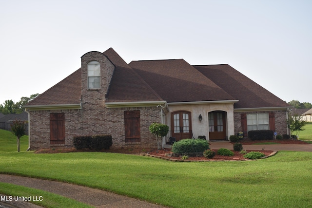 308 Barrington Cv, Byram, MS 39272 - view of front of property with french doors, a front yard, roof with shingles, and brick siding