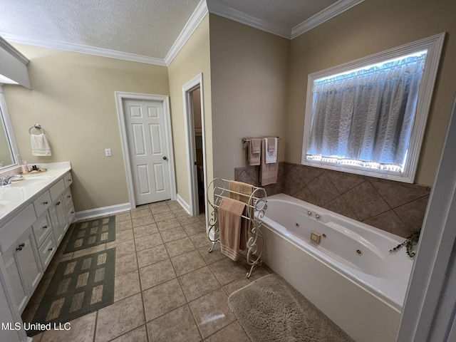 308 Barrington Cv, Byram, MS 39272 - bathroom featuring vanity, a tub with jets, tile patterned floors, crown molding, and baseboards