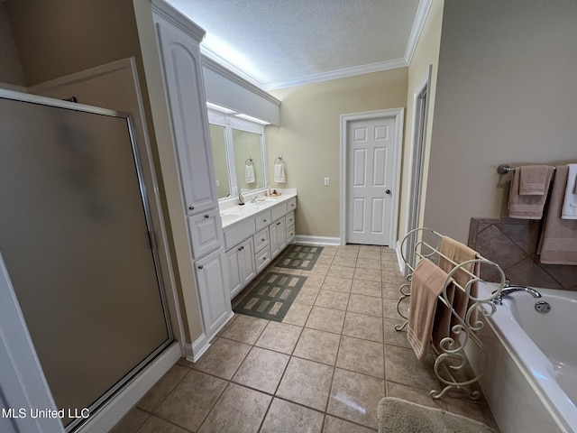 308 Barrington Cv, Byram, MS 39272 - bathroom with ornamental molding, vanity, a bath, a shower stall, and a textured ceiling