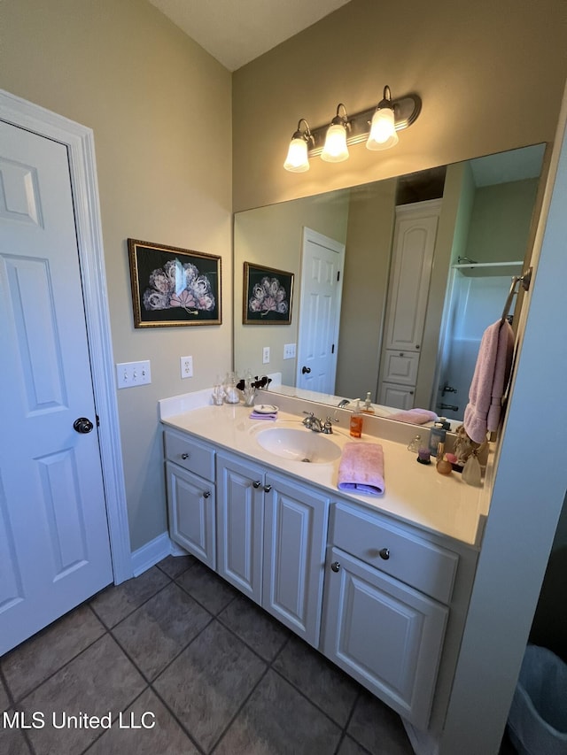 308 Barrington Cv, Byram, MS 39272 - bathroom featuring tile patterned flooring, vanity, and a shower with shower door