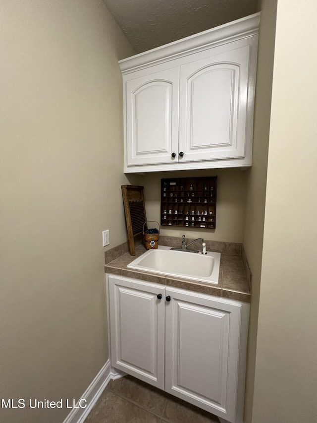 308 Barrington Cv, Byram, MS 39272 - bar with a sink and dark tile patterned floors