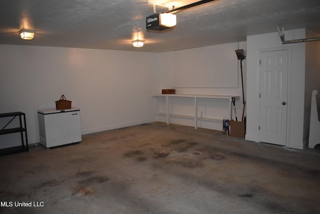 308 Barrington Cv, Byram, MS 39272 - garage with fridge and a garage door opener