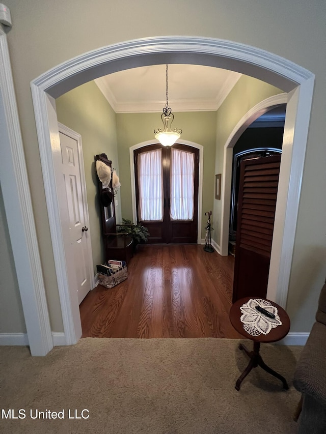 308 Barrington Cv, Byram, MS 39272 - entrance foyer featuring arched walkways, crown molding, wood finished floors, baseboards, and french doors