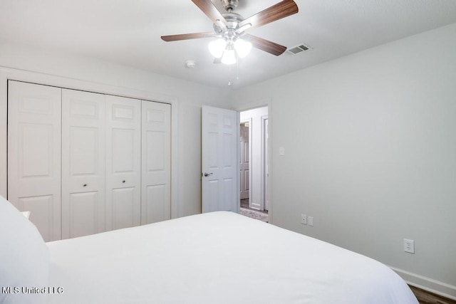 3109 Breezy Hill Ln, Ocean Springs, MS 39564 - bedroom featuring a closet, baseboards, and ceiling fan