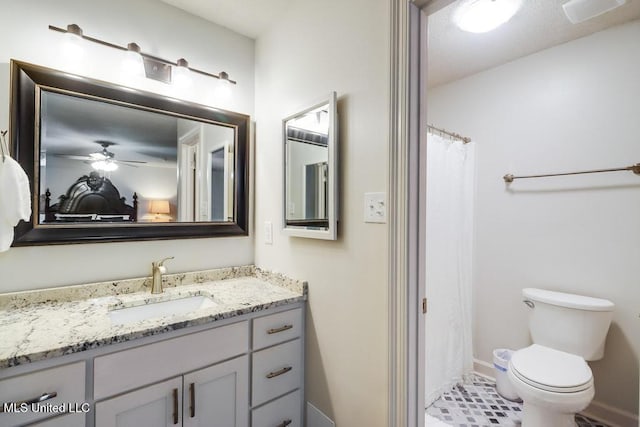 3109 Breezy Hill Ln, Ocean Springs, MS 39564 - full bathroom featuring vanity, baseboards, toilet, a shower with shower curtain, and a ceiling fan