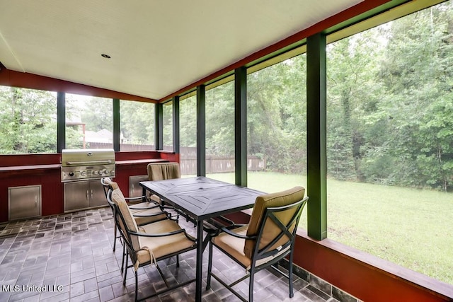 3109 Breezy Hill Ln, Ocean Springs, MS 39564 - sunroom / solarium featuring healthy amount of natural light, outdoor dining area, exterior kitchen, and lofted ceiling