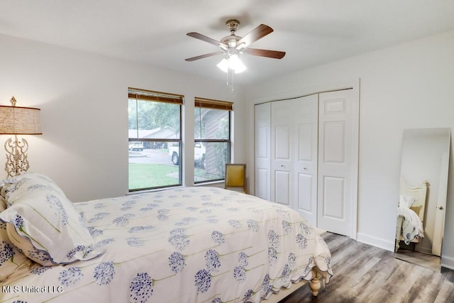 3109 Breezy Hill Ln, Ocean Springs, MS 39564 - bedroom with a closet, wood finished floors, ceiling fan, and baseboards