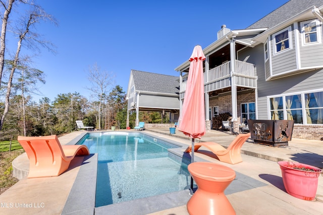 view of swimming pool with a patio area