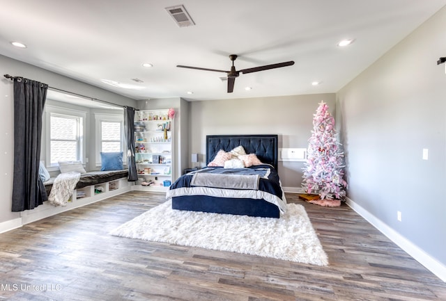 bedroom featuring ceiling fan and dark hardwood / wood-style flooring