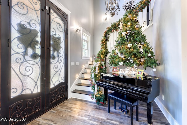 entrance foyer featuring french doors and hardwood / wood-style floors