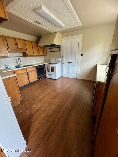 kitchen featuring custom range hood, white electric range oven, sink, and dark hardwood / wood-style flooring