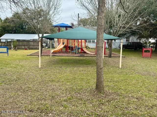 view of jungle gym with a lawn