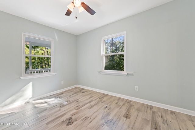 6071 Comanche St, Kiln, MS 39556 - empty room with wood finished floors, baseboards, and ceiling fan