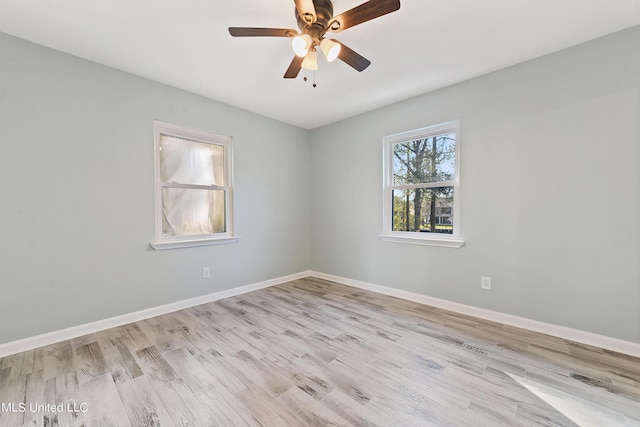 6071 Comanche St, Kiln, MS 39556 - empty room featuring wood finished floors, ceiling fan, and baseboards