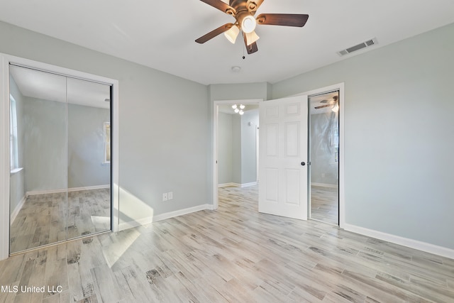 unfurnished bedroom with a closet, light hardwood / wood-style floors, and ceiling fan