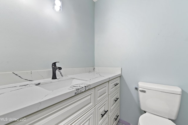 6071 Comanche St, Kiln, MS 39556 - bathroom featuring toilet and vanity