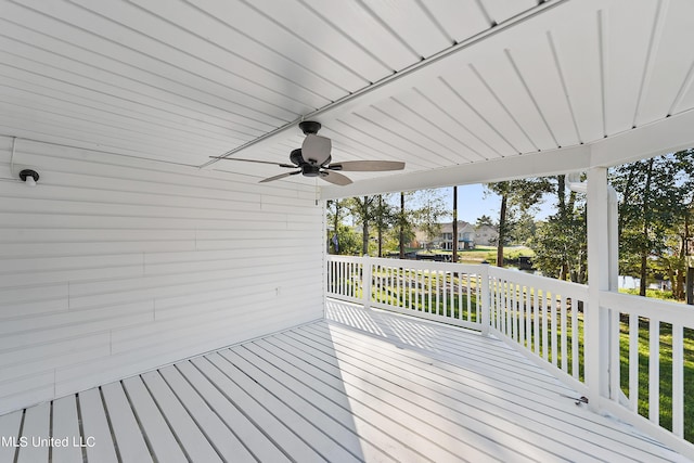 6071 Comanche St, Kiln, MS 39556 - wooden deck with ceiling fan and a residential view