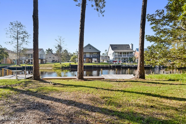 6071 Comanche St, Kiln, MS 39556 - dock area featuring a residential view, a water view, and a yard