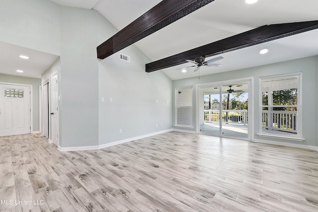 unfurnished living room with lofted ceiling with beams, light wood-type flooring, and ceiling fan