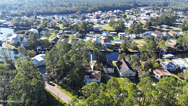 6071 Comanche St, Kiln, MS 39556 - aerial view of property and surrounding area with a large body of water, nearby suburban area, and a heavily wooded area
