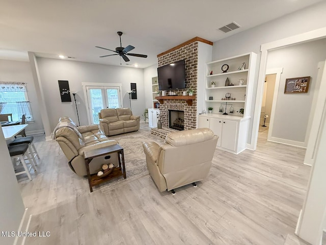 2290 Loisy Blvd, Hernando, MS 38632 - living area with a ceiling fan, light wood-style floors, a fireplace, baseboards, and recessed lighting
