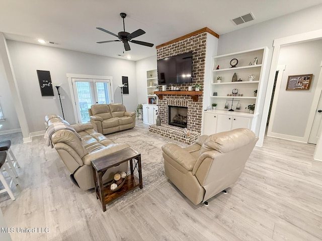 2290 Loisy Blvd, Hernando, MS 38632 - living room featuring a ceiling fan, light wood-style floors, baseboards, a fireplace, and recessed lighting