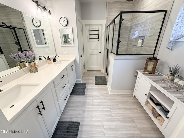 2290 Loisy Blvd, Hernando, MS 38632 - bathroom with double vanity, a shower stall, and baseboards